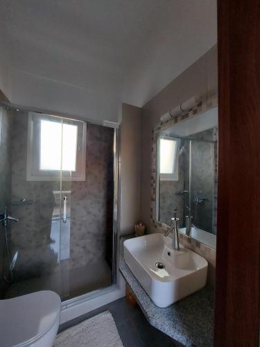a bathroom with a sink and a shower at Calliope#2 in Skala