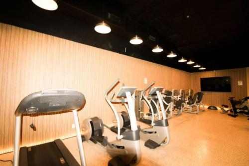 a row of exercise bikes in a gym at Castle B6 in Miami Beach