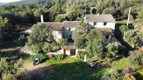 an aerial view of a house in a forest at Masiadenjust in Rojals
