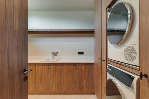 a bathroom with a sink and a mirror at Villa Mangoni - Brand New Luxury Villa in Funchal