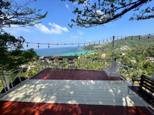 a balcony with a view of the ocean at Seaview Love Nest in Ko Phangan