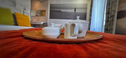 Kaffe- og tefaciliteter på Le Petit Trianon et le Charme des Suites