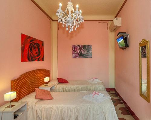 Postel nebo postele na pokoji v ubytování B&B La Mimosa