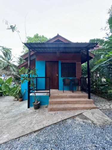 a small house with a blue at Hayar House's Cabin house at kantiang bay in Ko Lanta