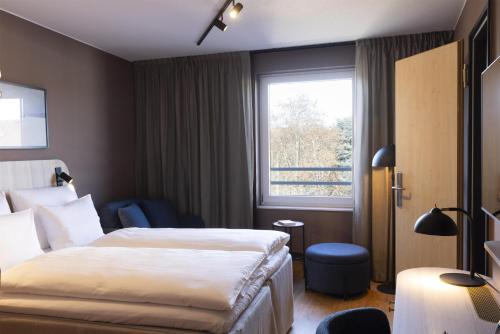 En eller flere senge i et værelse på Scandic Stuttgart Europaviertel