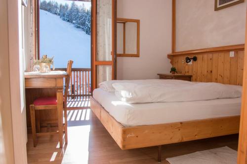 En eller flere senge i et værelse på Hotel Cristallo