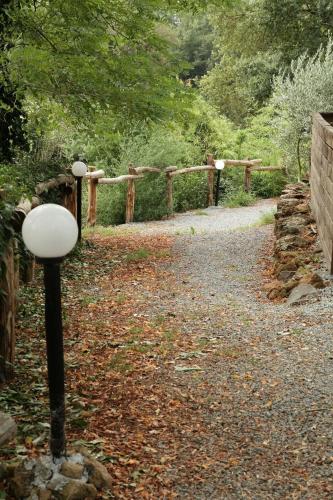 a path with a fence and a street light at Il Sentiero in Acquapendente