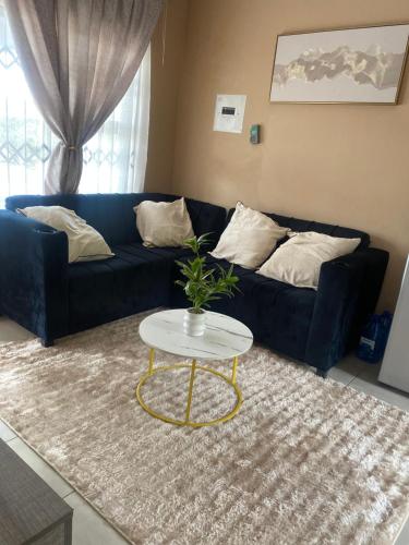 Posezení v ubytování Cozy Haven in Manzini