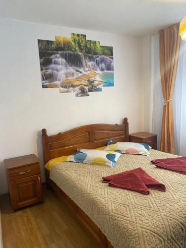 En eller flere senge i et værelse på Apartament Maria