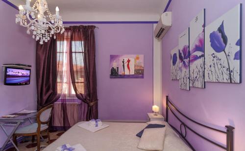 TV a/nebo společenská místnost v ubytování B&B La Mimosa