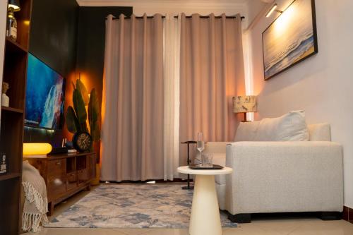 The Modern Nest Stylish 1BR MbeziBeach with Fast WiFi, Work Desk & Smart Home