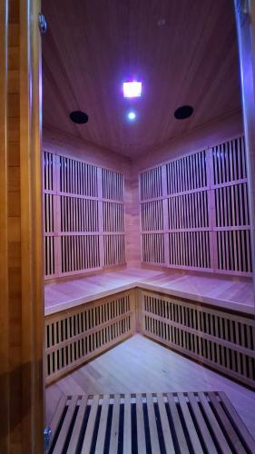 a large empty room with a bench in it at Edelweiss Vila Šventoji in Šventoji