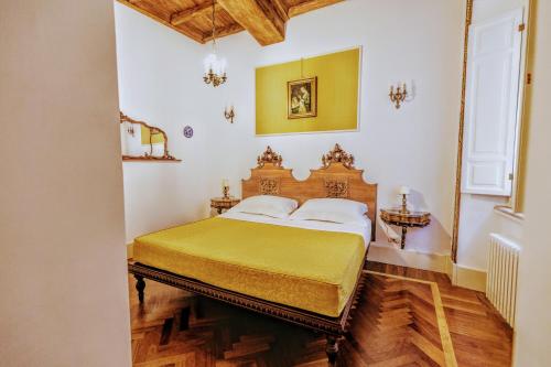 a bedroom with a large bed in a room at Arpinelli Suite in Rome