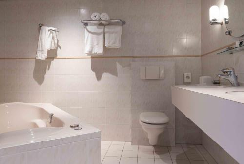 Phòng tắm tại Hampshire Hotel Petit Nord