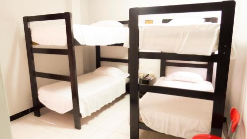 Una cama o camas en una habitación de Jer`s Hostal