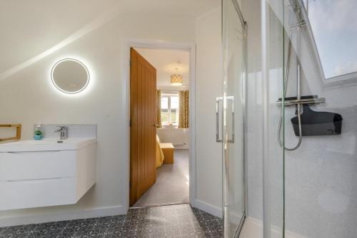a bathroom with a sink and a shower at 4 Bed in Aberarth oc-g30835 in Aberaeron