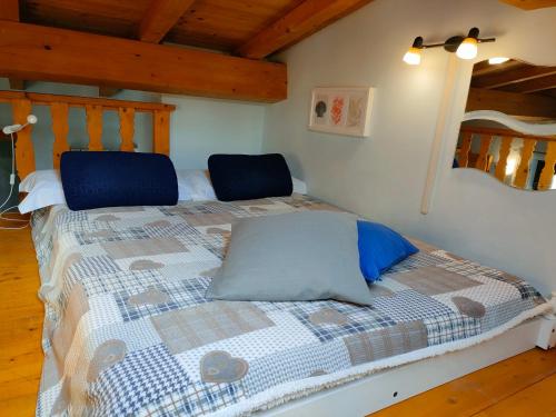 a bedroom with a bed with two pillows on it at Il villaggio affittacamere in Valmontone