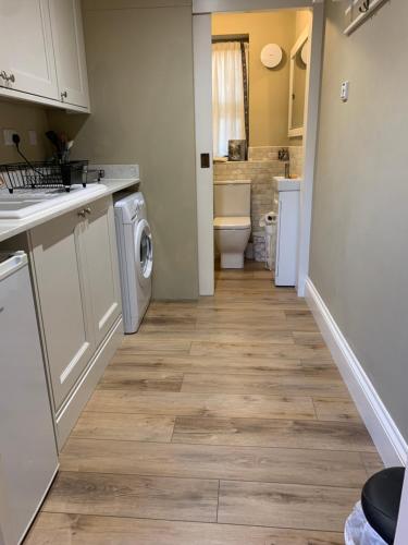a kitchen with a washer and dryer at The Somerton Hideaway in Somerton
