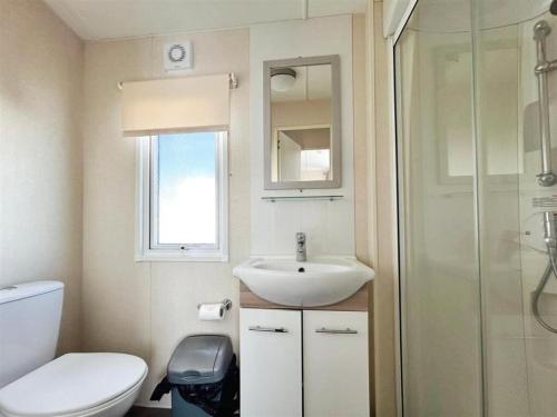 a bathroom with a toilet and a sink and a shower at Seaview Holiday Park - 2 bedroom sleeps 6 Family & Pet friendly in Chestfield