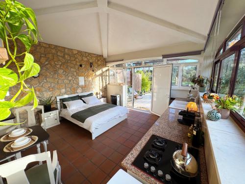 a bedroom with a bed in the middle of a room at Quinta Ivonne in Montemor-o-Velho