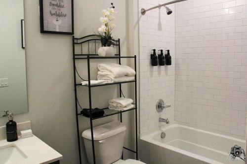 a bathroom with a toilet and a shower and a sink at Cincinnati Downtown Oasis in Cincinnati