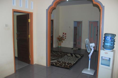 a hallway with a mirror and a hair dryer at Jelajah Batukaras in Batukaras