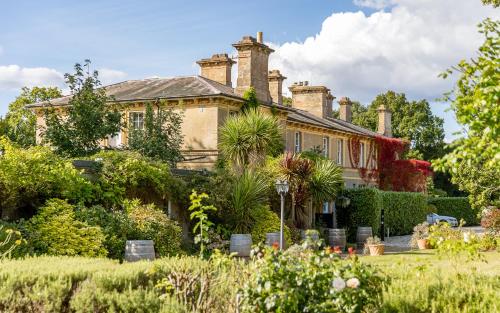 a house with a garden in front of it at Albert Cottage Hotel in East Cowes