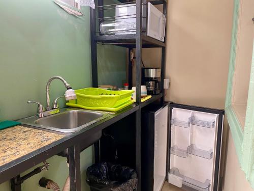 a kitchen with a sink and a counter top at Mini Suite Apartamento in San Pedro Sula