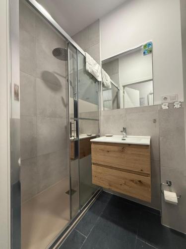 a bathroom with a sink and a shower at HS Beach in Torrevieja