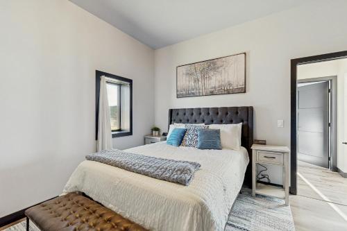 a bedroom with a large bed and a window at The 19th Hole in Sturgis