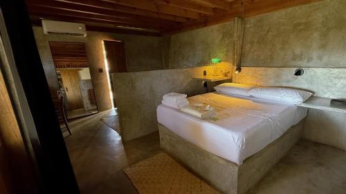 a bedroom with a large bed in a room at Lalito in Zipolite