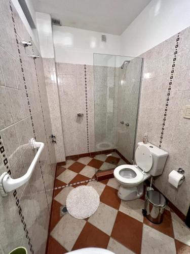 a bathroom with a toilet and a shower at Welindo Loft in Salta