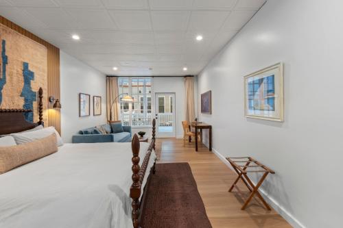 a bedroom with a bed and a living room at The Optimist Guesthouse | 5 in Camden