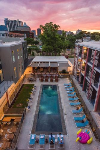 an overhead view of a pool on top of a building at The Cabins at East Austin Hotel in Austin