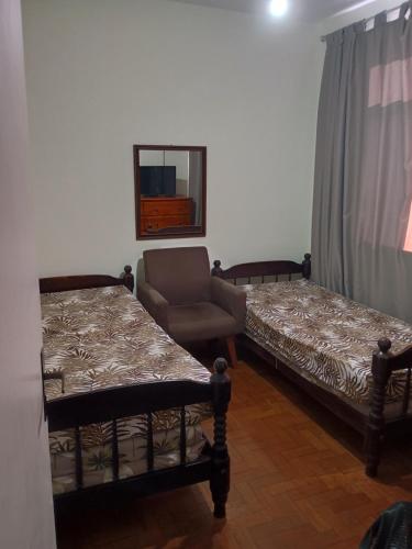 En eller flere senge i et værelse på Apartamento aconchegante no centro de Cabo Frio