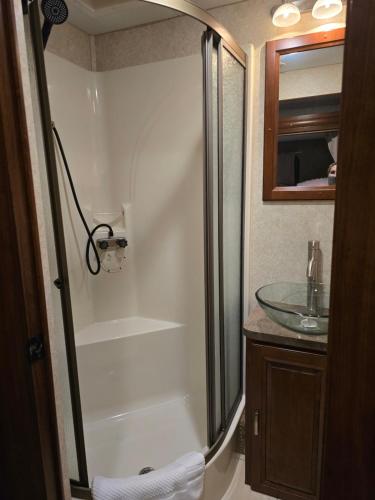 a bathroom with a shower and a sink at Tiki Cabana at Key Largo in Key Largo