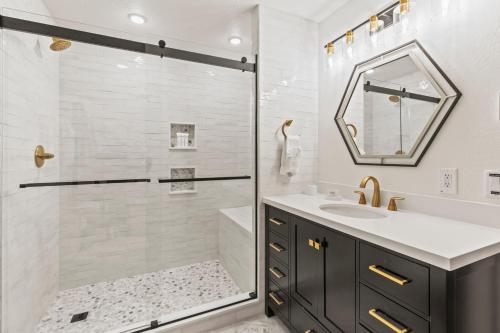 a bathroom with a shower and a sink at Abode at Fish Creek in Wilson