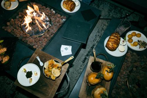 a table with food on it with plates of food at Caesars Republic Lake Tahoe, A Caesars Destination in Stateline
