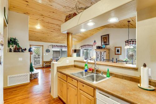 a kitchen with a sink and a counter top at Hike, Fish & Enjoy Pond On-Site: Bison Ranch Cabin in Overgaard