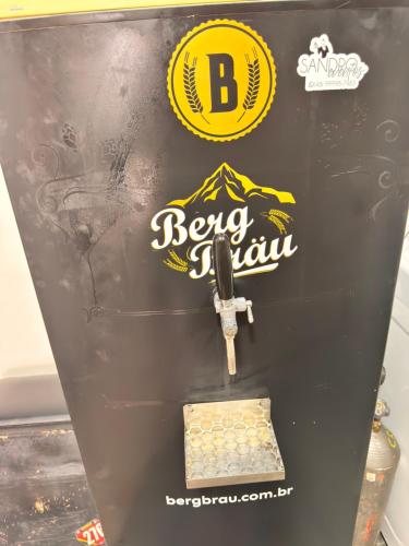 a baseball machine with a sign on the side of it at Pousada Vivenza - Suíte Super Confort 01 in Laguna