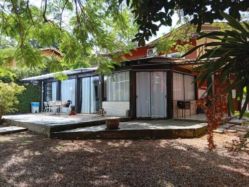 a house with a porch and a patio at Casa com spa hidromassagem in Florianópolis