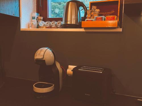 a bathroom with a toilet with a coffee maker at Villa "Pahulja" - Vlašić in Vlasic