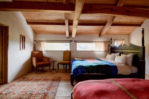 En eller flere senge i et værelse på Hotel Namaskar