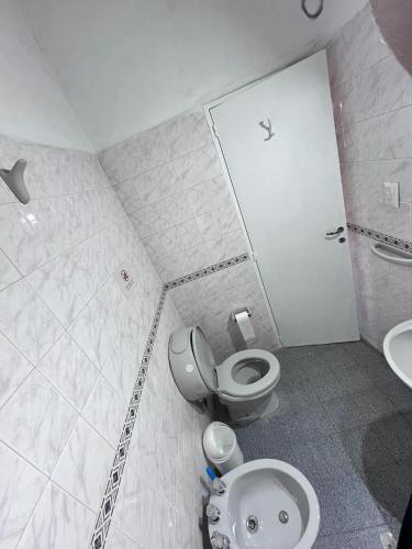 a bathroom with a toilet and a sink at Casa Luna Bca in El Mollar