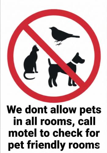 a sign that says we dont allow pets in all rooms and call model to at Copper City Motel in Cobar