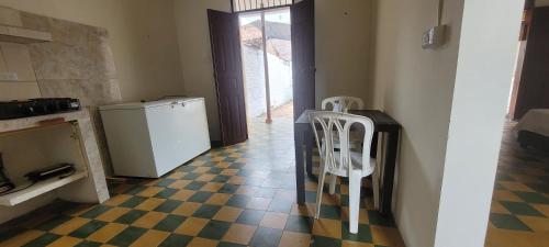 a kitchen with a checkered floor and a refrigerator at La Ermita apto in Roldanillo