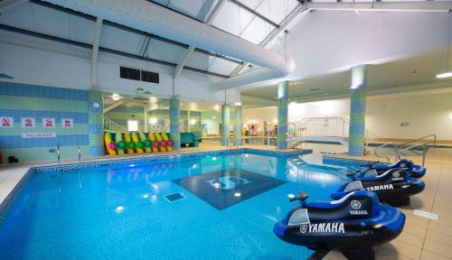 a large swimming pool with an inflatableride in the middle at Secluded spot on Southview 8 berth in Lincolnshire