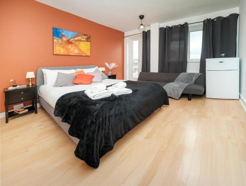 a bedroom with a bed with two towels on it at 5 of 5 Room Cozy, spacious and modern in Camden Town in London