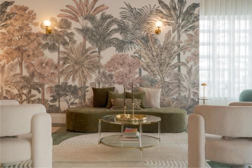 a living room with a couch and a table at Le Particulier Miami in Miami Beach