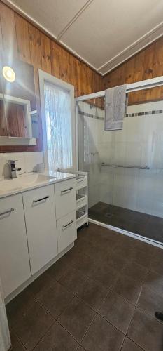 a bathroom with a shower and a sink at Main St Heritage Charm & Walk to Restaurants in Mount Tamborine